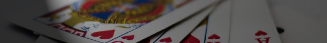 Playing cards with banknotes and coins for gambling